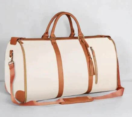 Beige travel bag with brown leather accents and a detachable shoulder strap.