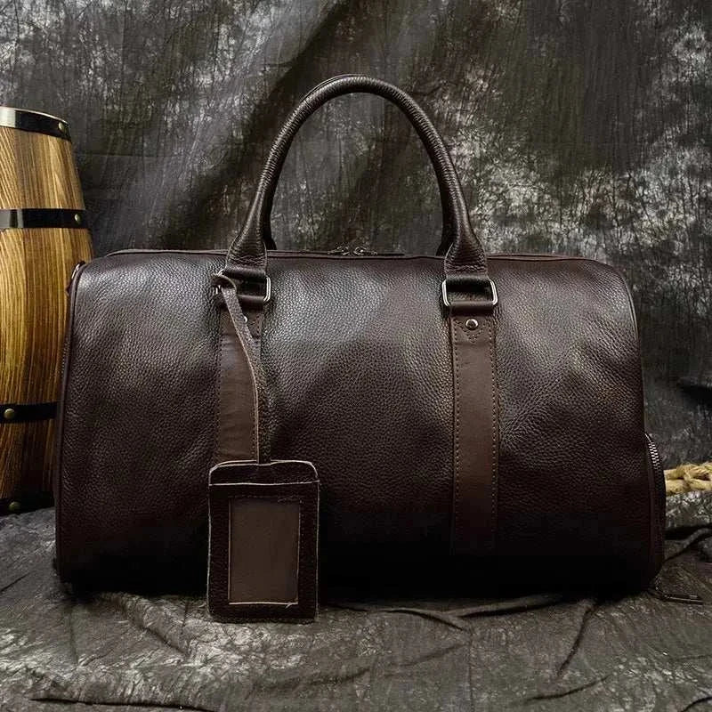 Genuine leather travel bag with spacious interior and ergonomic design.