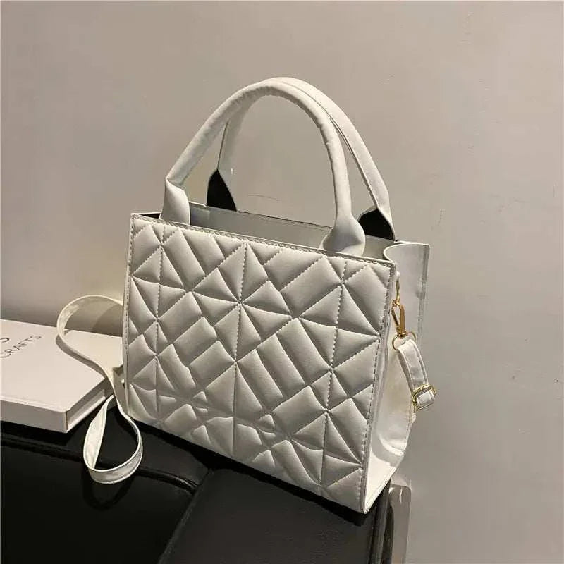 Fashion Shoulder Bag with diamond lattice design and adjustable strap.