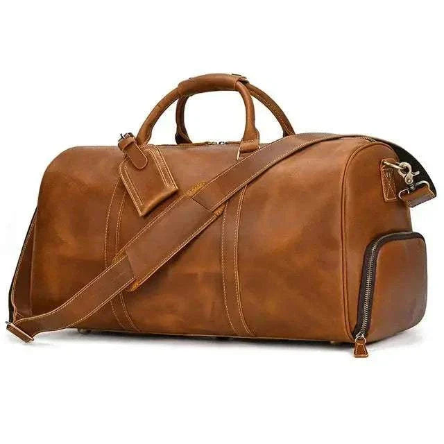 Genuine leather travel bag with padded straps and multiple compartments.