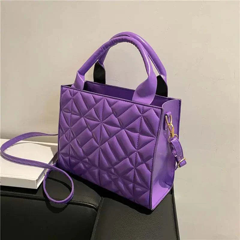 Purple fashion shoulder bag with diamond lattice design and adjustable strap.