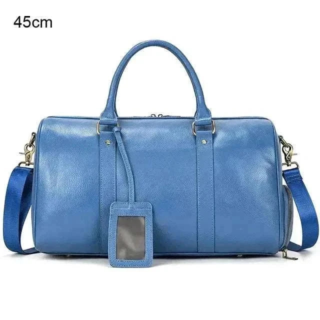 45cm blue genuine leather travel bag with handles and shoulder strap.