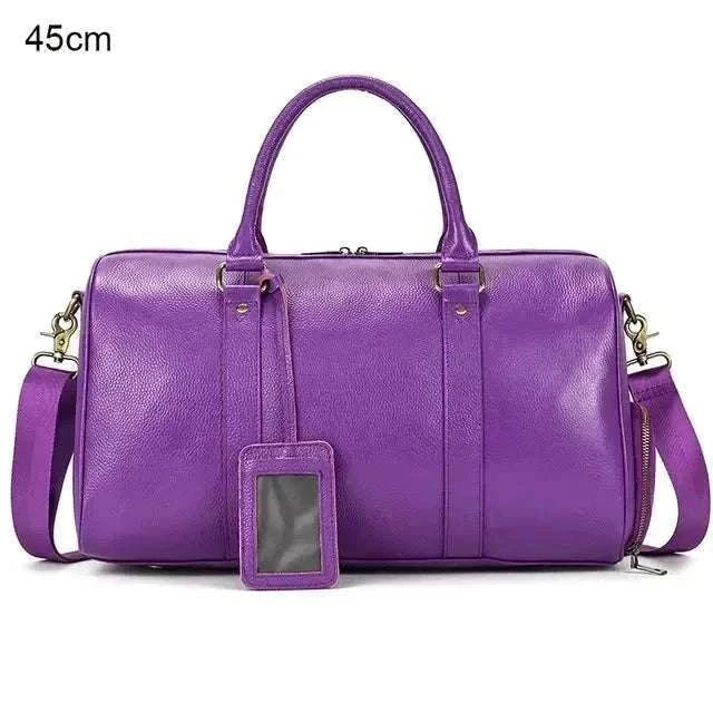 Purple genuine leather travel bag with spacious interior and ergonomic design.