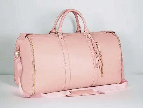 Pink Voyager Travel Bag with multiple compartments and padded straps for comfort and durability.