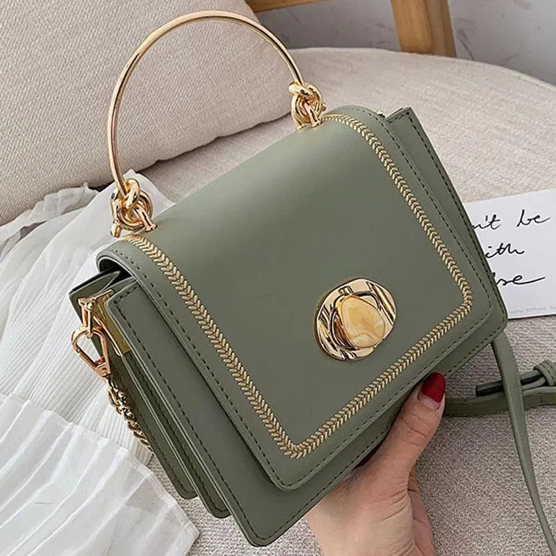 Fashionista Crossbody Bag in sage green with gold accents, featuring a sleek and chic design, perfect for all occasions.