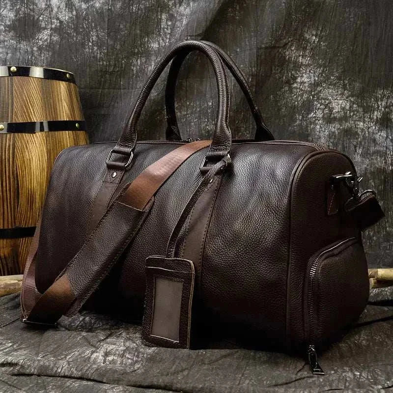 Genuine leather travel bag with spacious interior and multiple compartments.