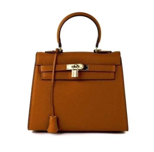 The Los Angeles Bag in brown leather with gold hardware, showcasing sophisticated design and luxury craftsmanship.