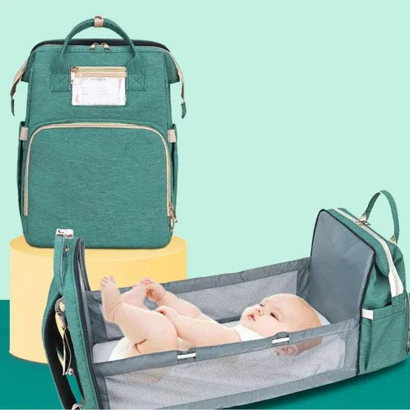 Unisex Baby Nappy Changing Bag with folding crib bed and large-capacity storage for travel.