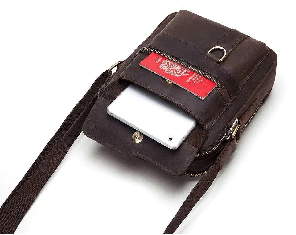 Vintage Leather Messenger Bag with compartments for tablet and passport.