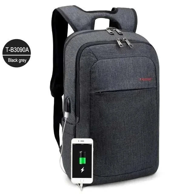 Durable anti-theft laptop backpack in black grey with USB charging port, ideal for 15.6-inch laptops.