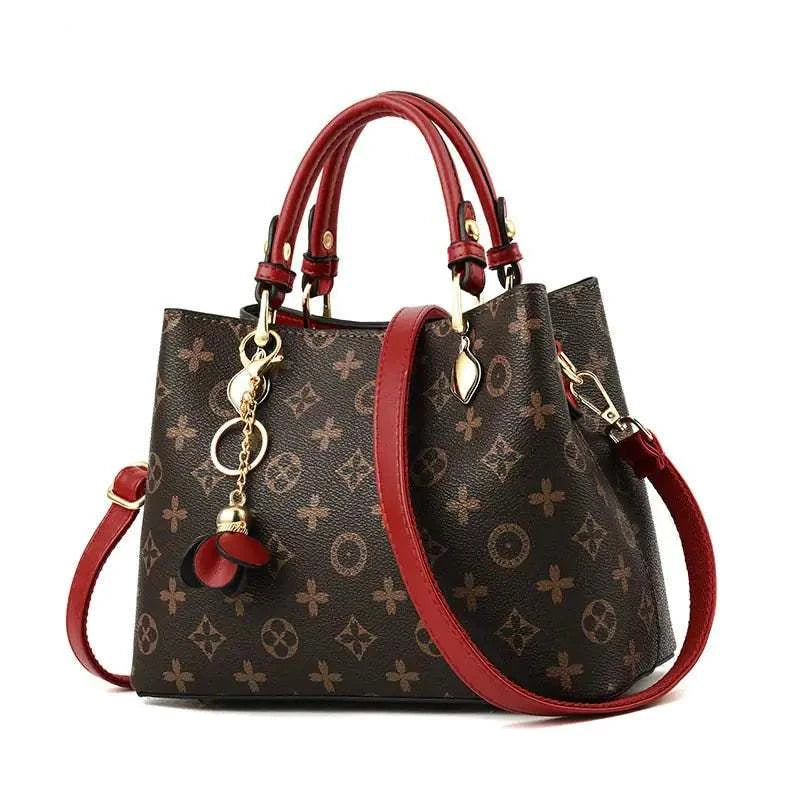 Elegant tote bag with red straps and floral pattern, showcasing craftsmanship from top tote bag designers.