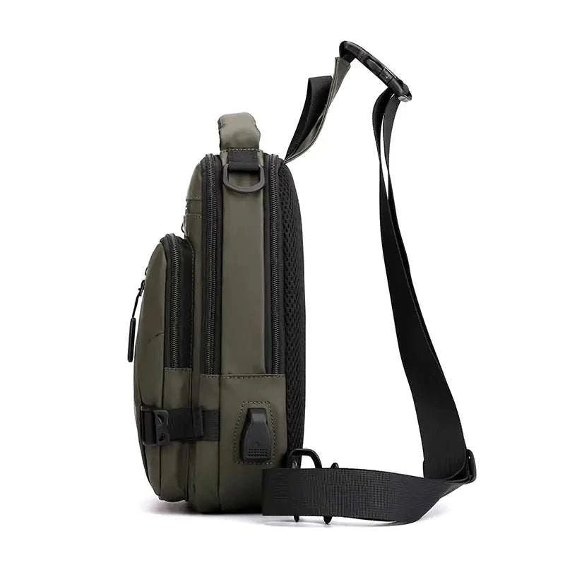 USB Charging Body Bag with built-in USB port, olive color, side view showing ergonomic design.