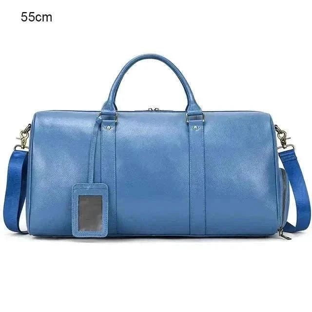 Genuine leather travel bag in blue with spacious interior and ergonomic design.